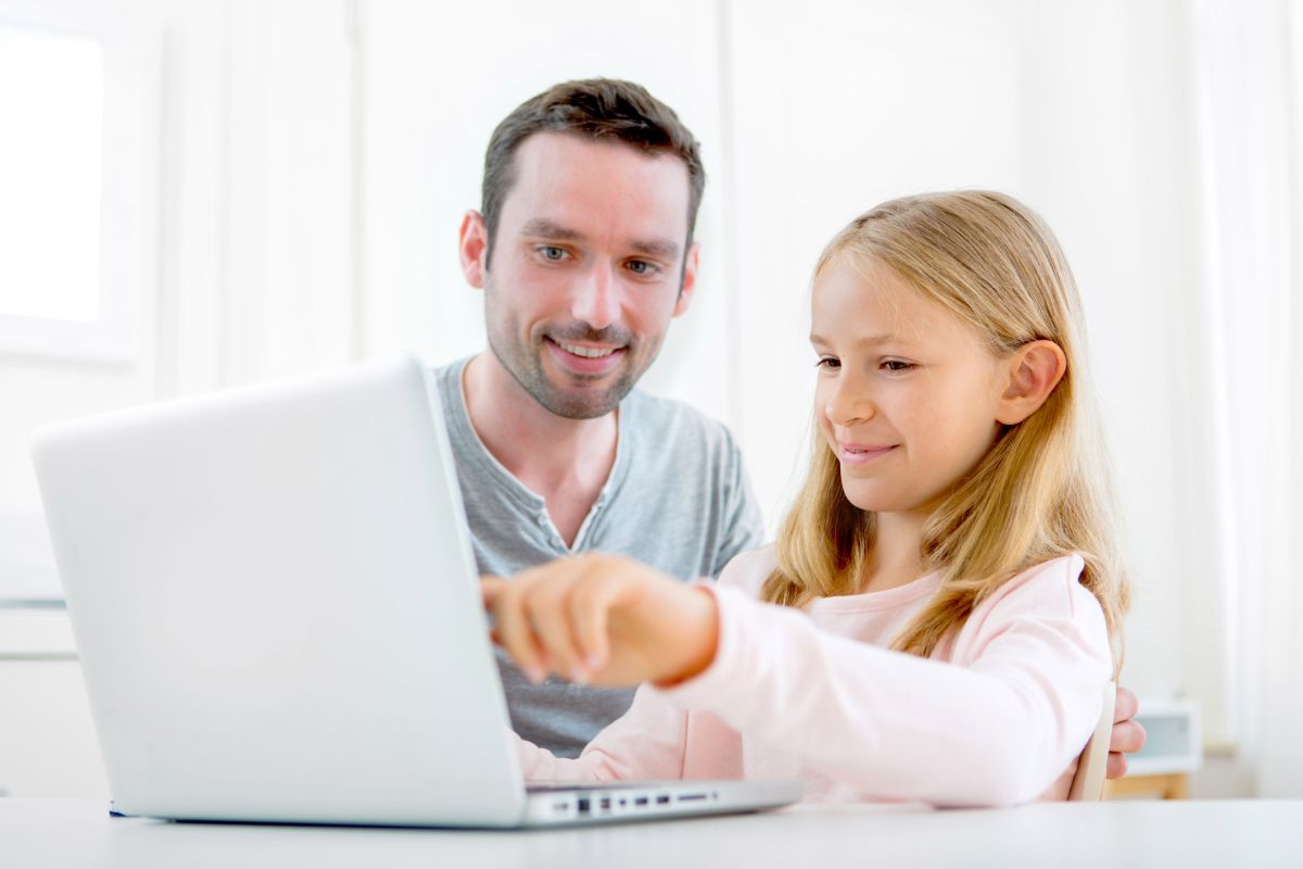 Father and Daughter undertaking Distance Education